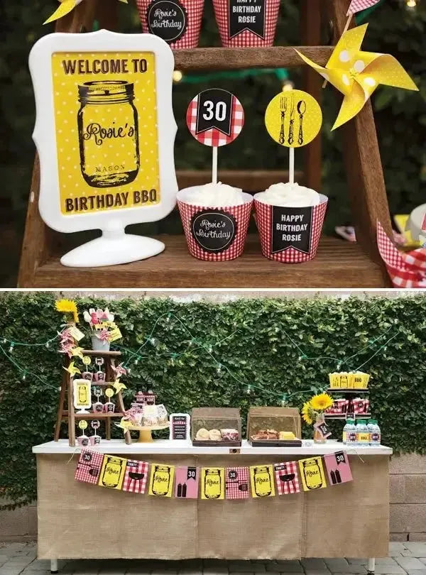 30th birthday barbecue party table with yellow decor, cupcakes, and welcome sign outdoors