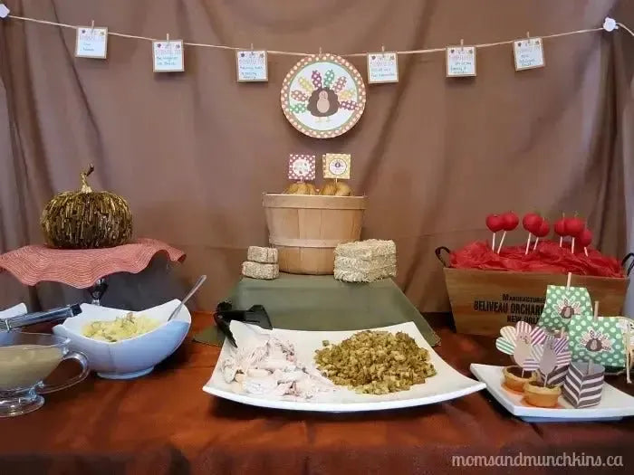 Thanksgiving kids table with turkey decorations, festive food, and themed desserts