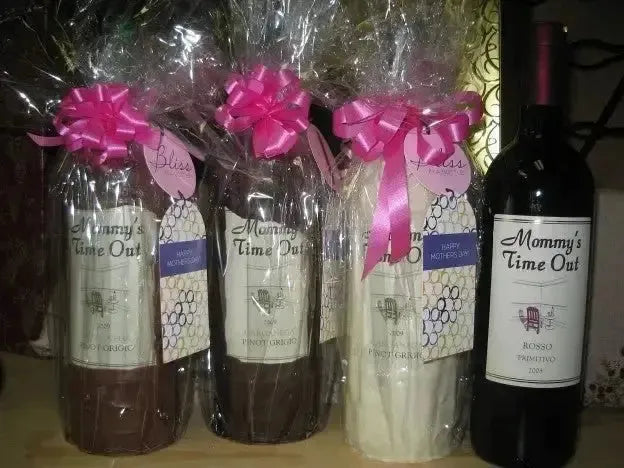 Gift-wrapped Mommy's Time Out wine bottles with pink bows, labeled for Mother's Day.