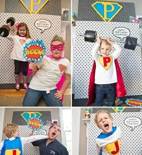 Children in superhero costumes posing at a superhero birthday party photo booth.