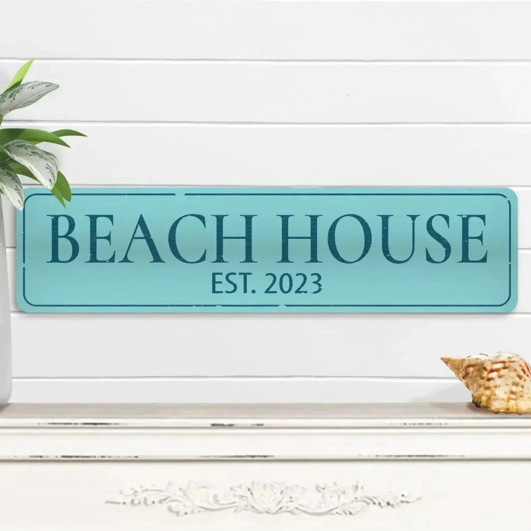 Custom coastal beach house sign decor with aqua blue nautical theme, plant, seashell on shelf