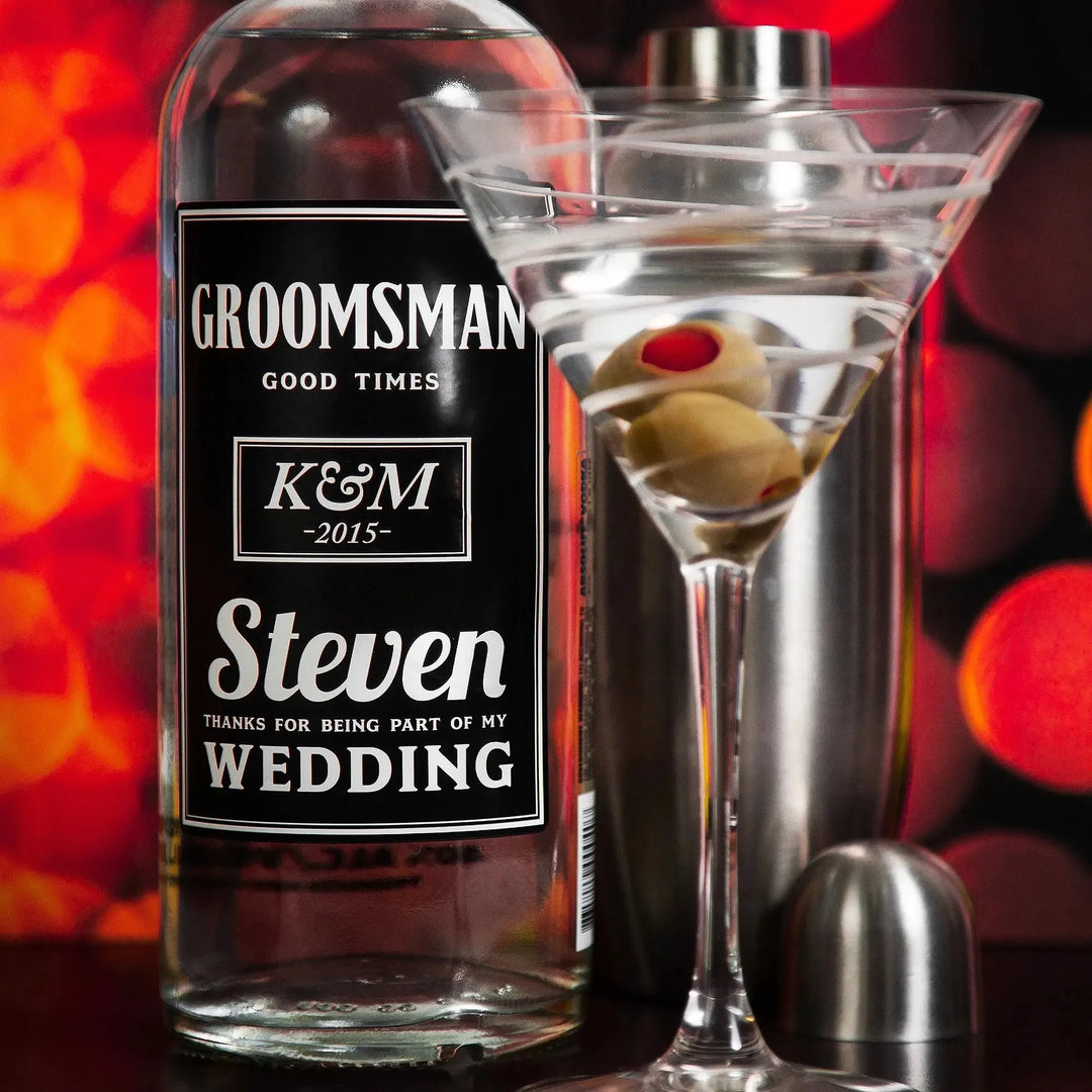 Personalized groomsman liquor bottle with custom wedding label and martini glass with olives
