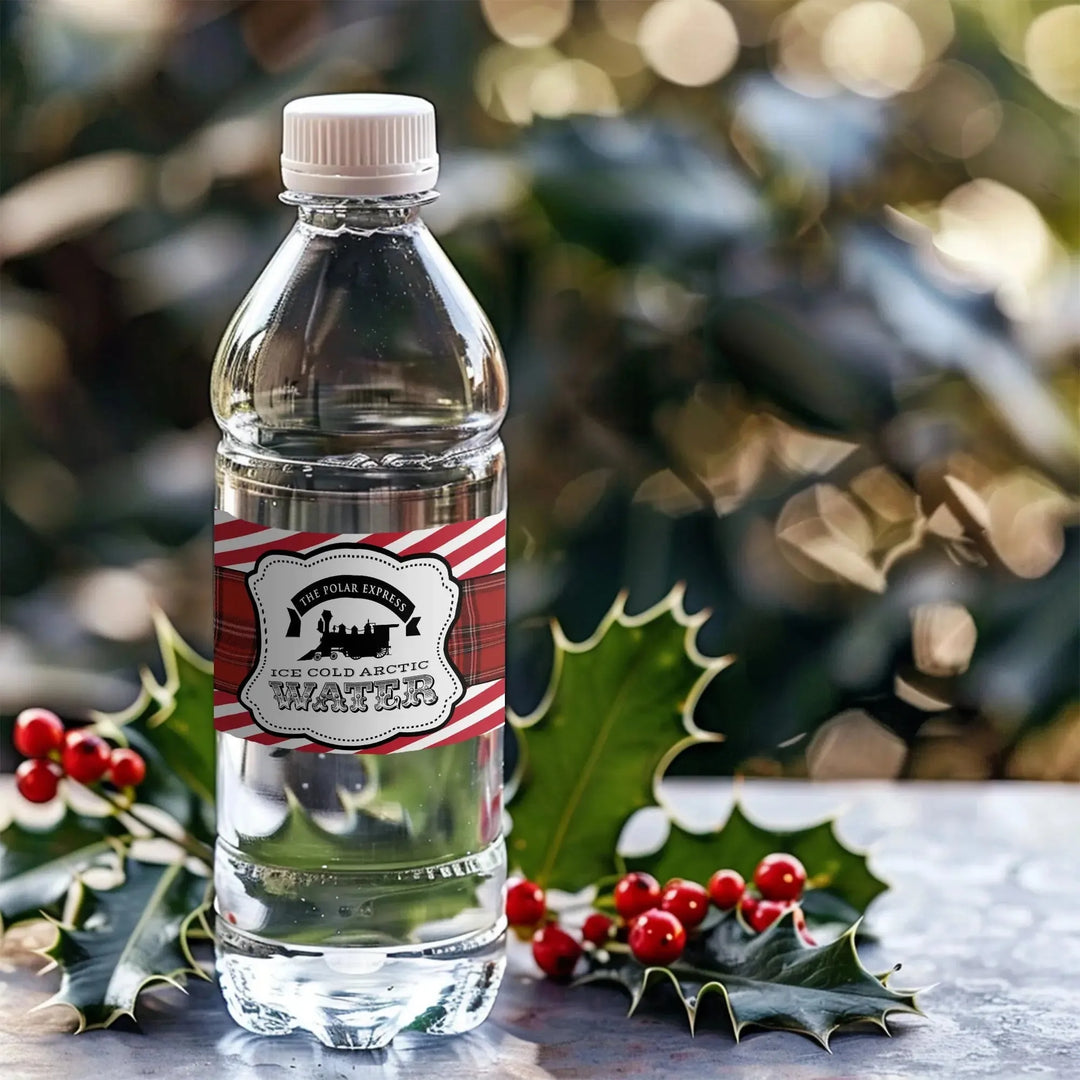 Custom holiday water bottle with Polar Express label and festive holly berries decor