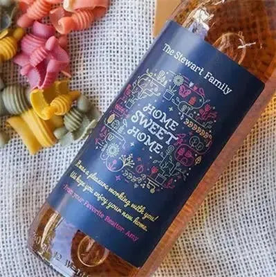 Custom real estate wine label reading 'Home Sweet Home' on a bottle, ideal closing gift