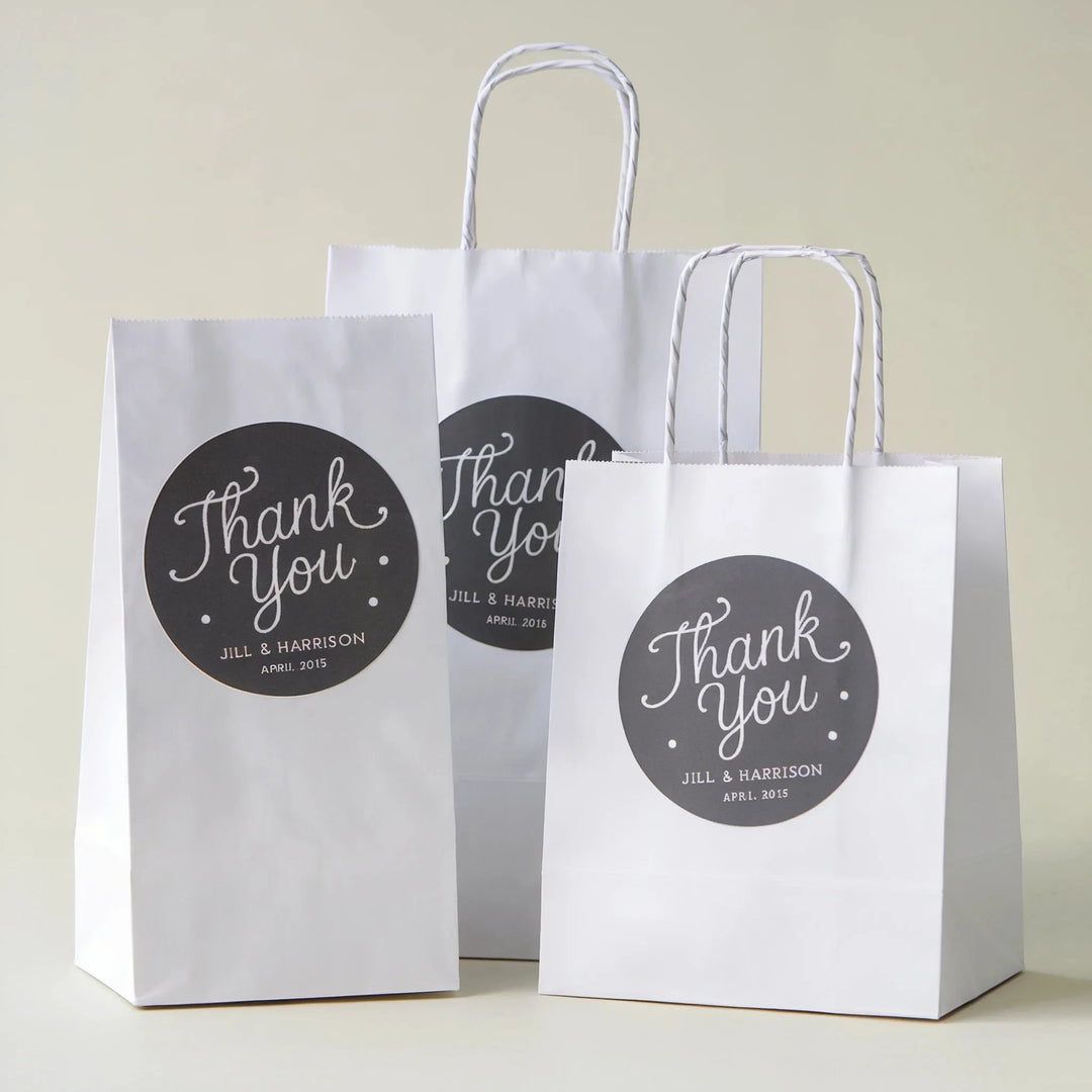 White wedding favor bags with custom thank you labels for gifts and decor