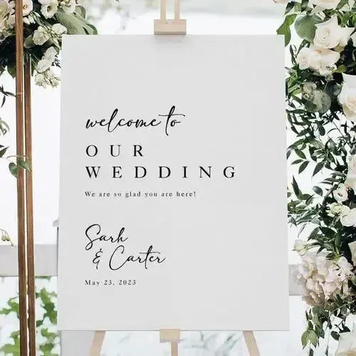 Custom wedding welcome sign on easel with floral decor, personalized for Sarah and Carter