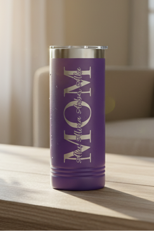 Purple 22 oz skinny Polar Camel tumbler with 'MOM' text on a wooden surface