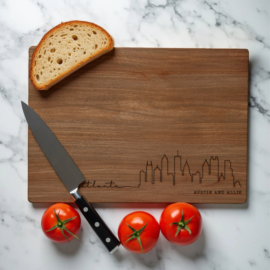 Atlanta Georgia skyline cutting board on marble with bread, tomatoes, and knife