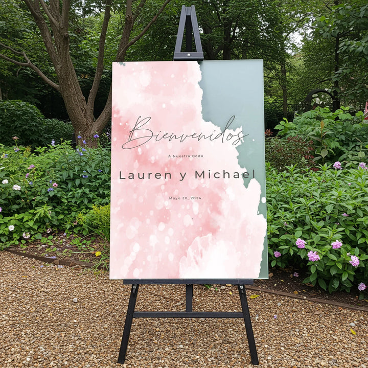 Outdoor wedding welcome sign in blush and blue with names Lauren y Michael and date May 20, 2024