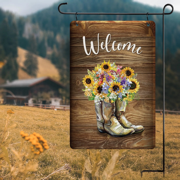 Rustic garden flag with welcome text featuring cowboy boots filled with colorful sunflowers and wildflowers