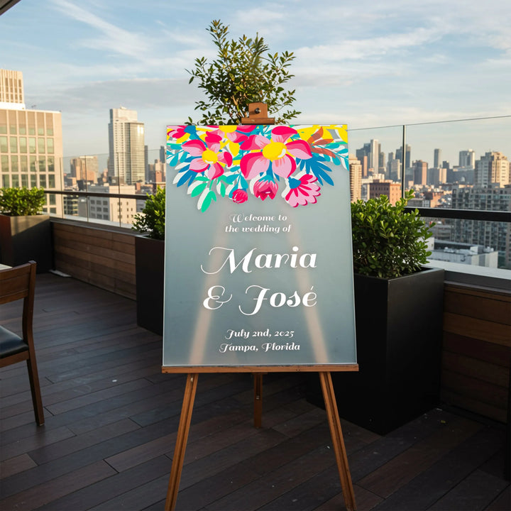 Wedding welcome sign with bright floral design for Maria and José, dated July 2, 2025, Tampa, Florida