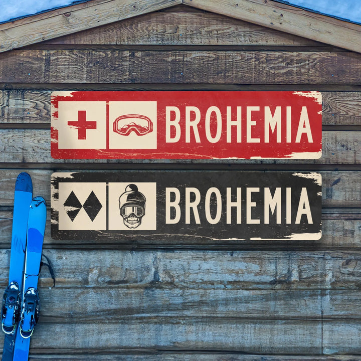 Distressed metal ski trail signs with BROHEMIA text and ski goggles, skull logos on wooden wall with blue skis
