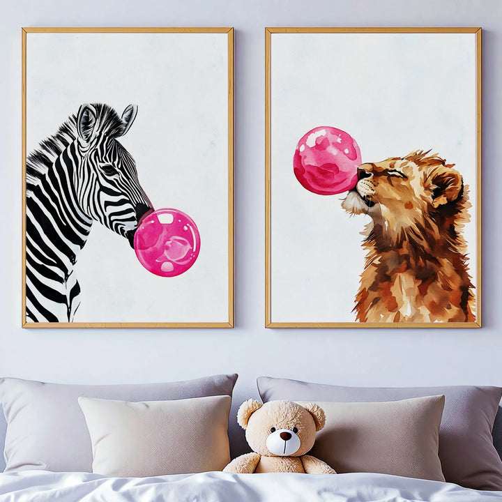 Nursery wall art of watercolor zebra and lion blowing pink bubblegum bubbles above bed with teddy bear
