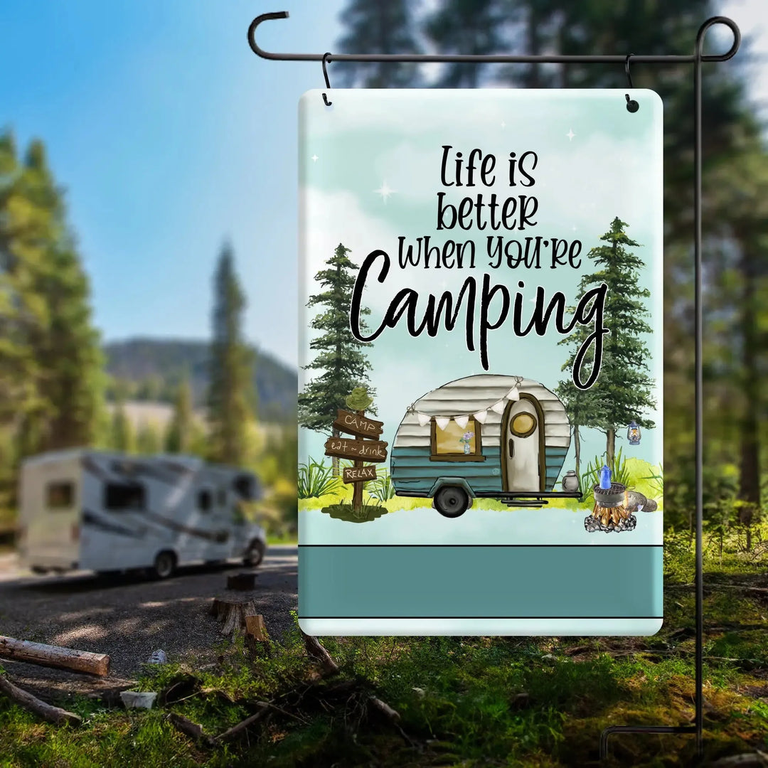 Metal garden flag with camping trailer illustration and text Life is better when you're camping