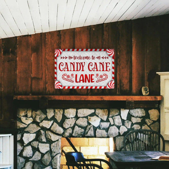 Rustic room with stone fireplace and red white welcome to Candy Cane Lane metal sign