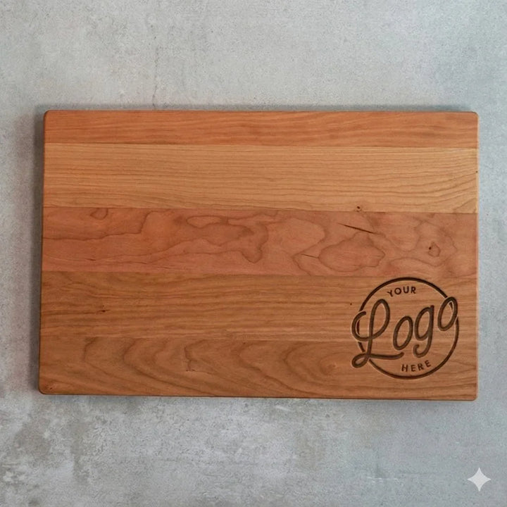Rectangular wooden cutting board with engraved customizable logo area on lower right corner on concrete surface