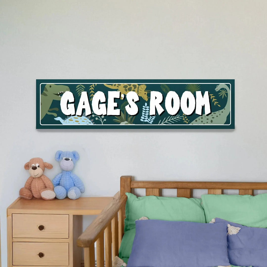 Kids bedroom with wooden bed, green and blue pillows, teddy bears, and dinosaur-themed Gage's Room metal sign