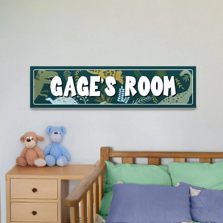 Kids bedroom with wooden bed, green and blue pillows, teddy bears, and dinosaur-themed Gage's Room metal sign