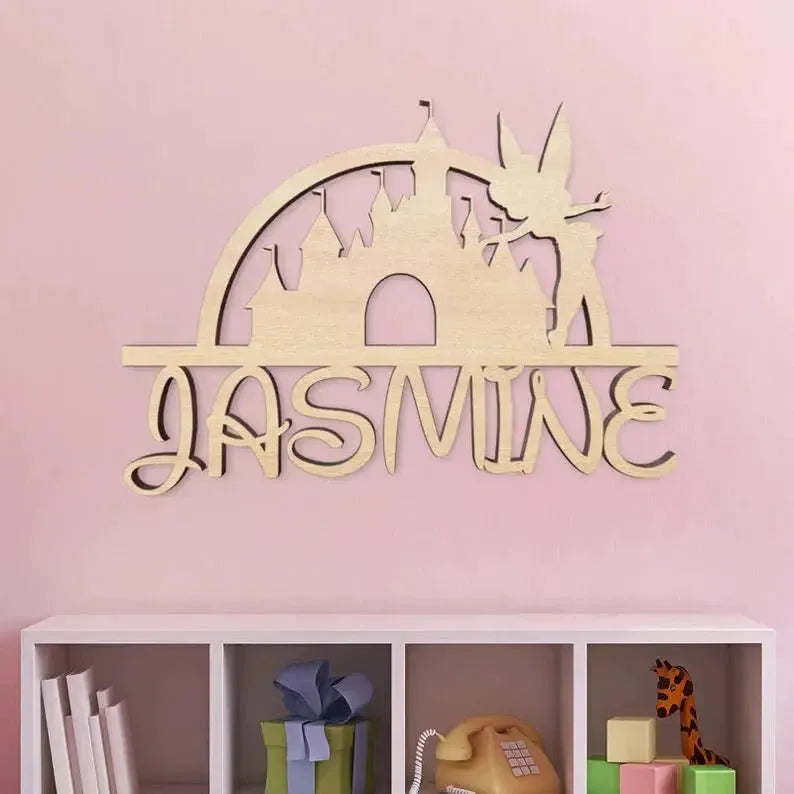 Disney-inspired wood name sign with castle and fairy, personalized for Jasmine on pink wall