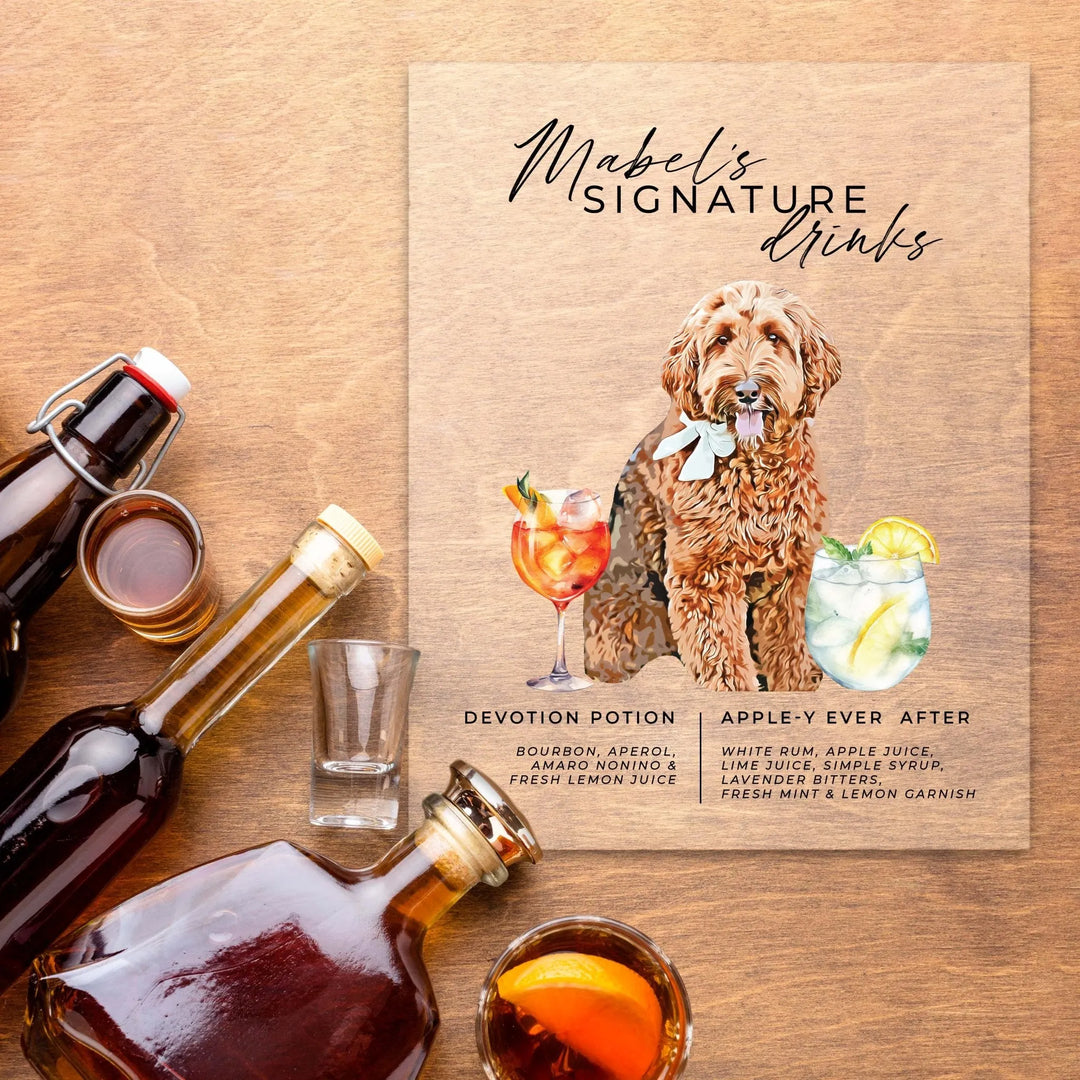 Wooden sign with illustration of a dog and two cocktail recipes: Devotion Potion and Apple-y Ever After