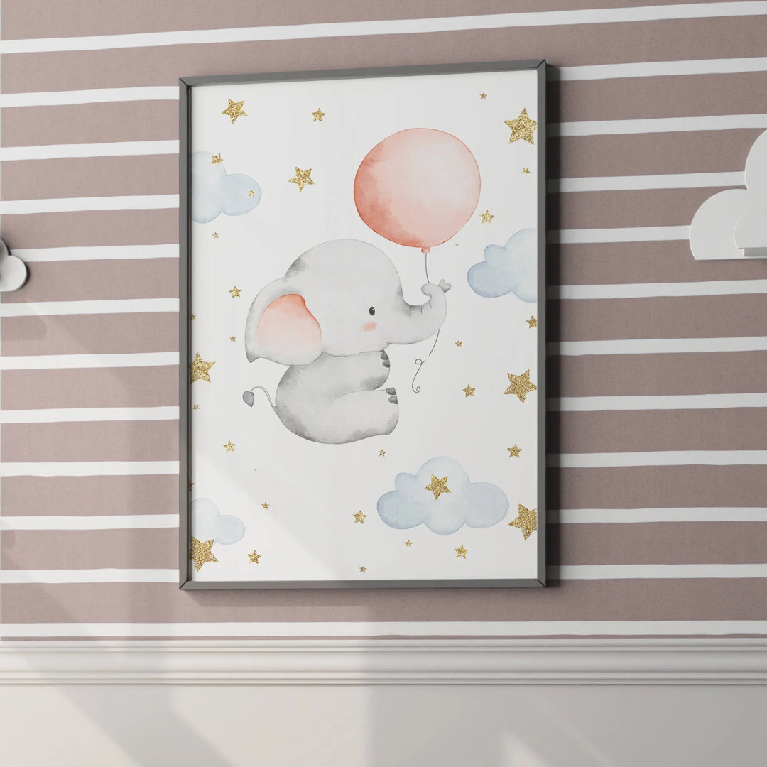 Cute nursery wall art of gray baby elephant holding pink balloon with clouds and gold stars