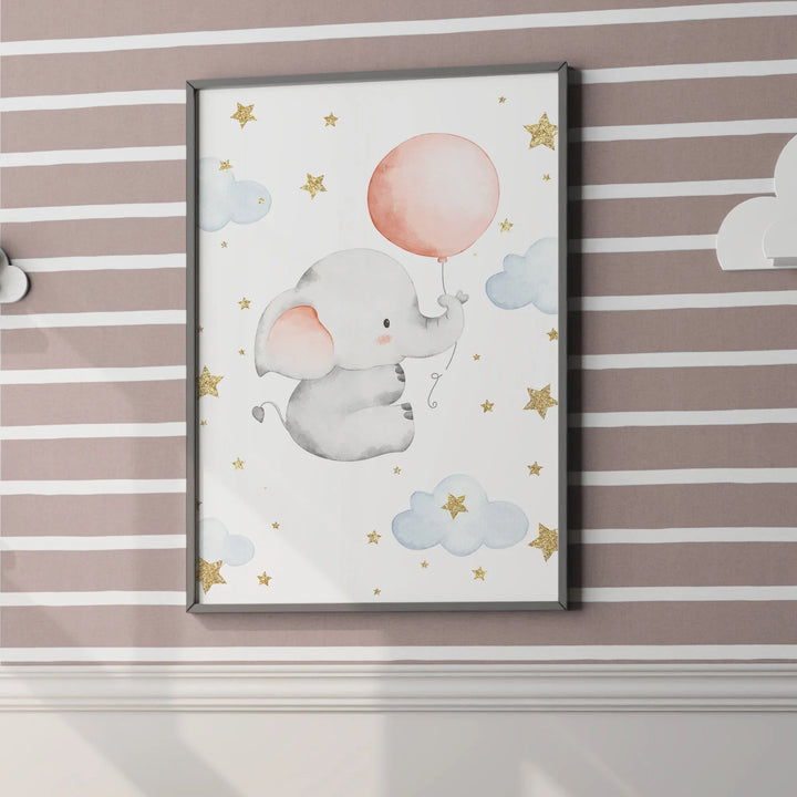 Cute nursery wall art of gray baby elephant holding pink balloon with clouds and gold stars