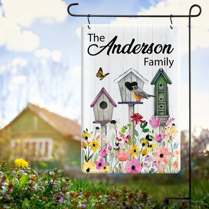 Personalized garden flag with birdhouses, robin, butterfly, colorful flowers, and Anderson family name