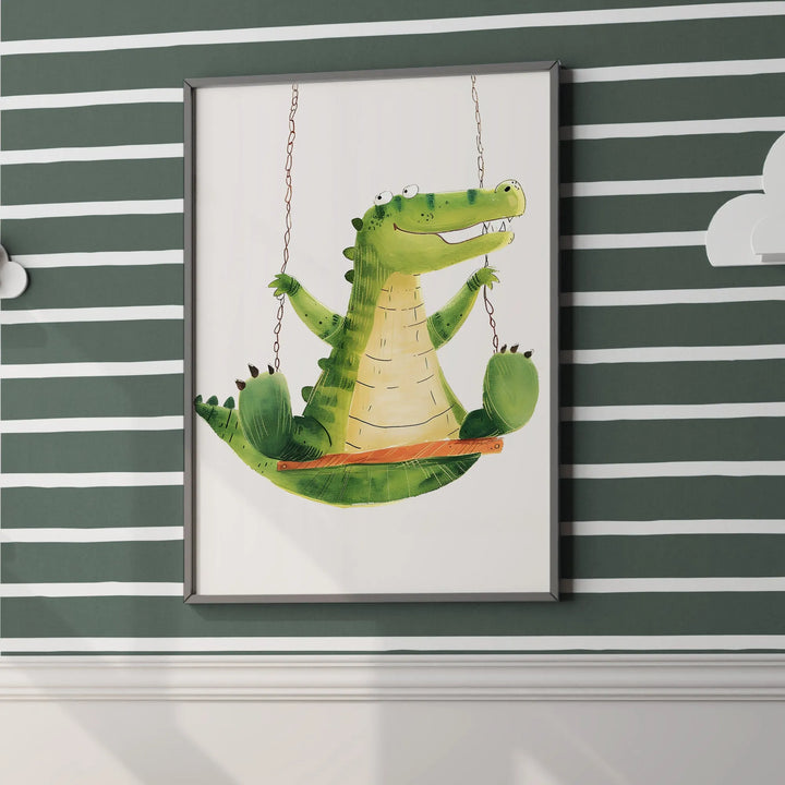 Nursery wall art of a cute green alligator swinging on a swing against striped dark green wallpaper