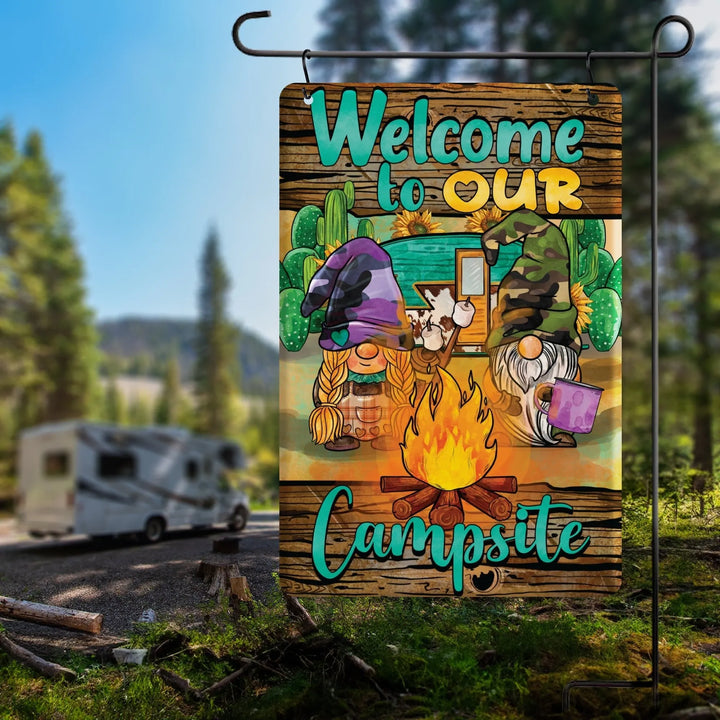 Colorful garden flag with gnome couple, campfire, camper, cacti, and text Welcome to Our Campsite