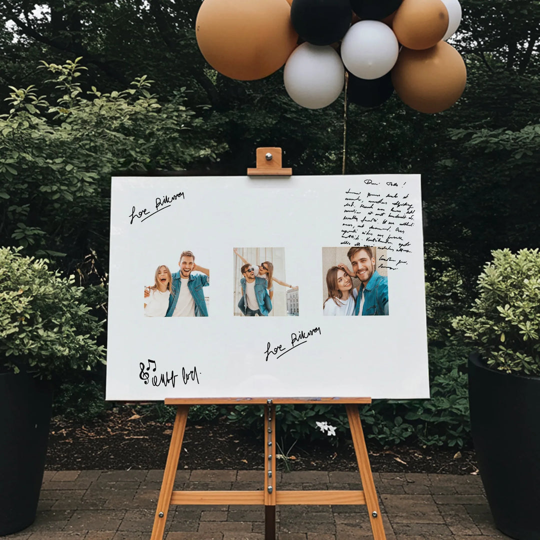 Outdoor wedding guest book board with couple photos, handwritten messages, and balloons