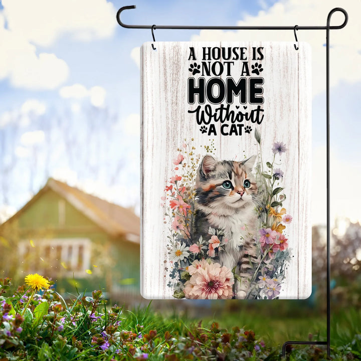 Metal garden flag with a kitten and flowers, text reads 'A house is not a home without a cat'