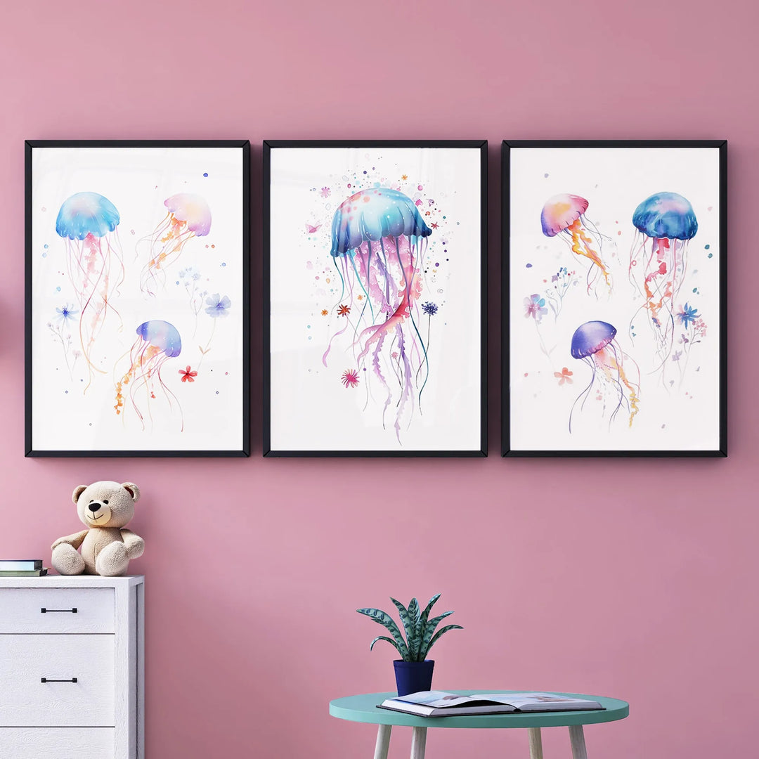 Whimsical watercolor jellyfish nursery wall art in three black frames on pink wall