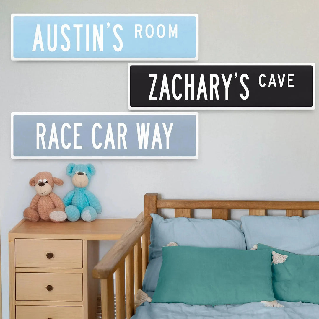 Kids' room with personalized metal street signs Austin's Room, Zachary's Cave, Race Car Way on wall