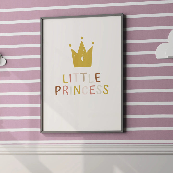 Framed nursery wall art with gold crown and colorful 'Little Princess' text on pink striped wall