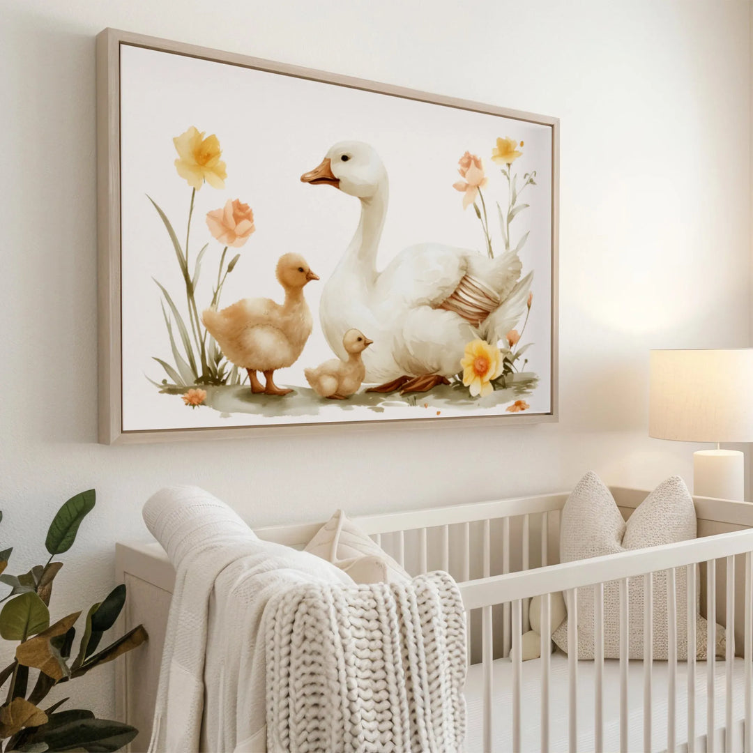 Watercolor nursery wall art of a white mama goose with two ducklings and floral accents above crib