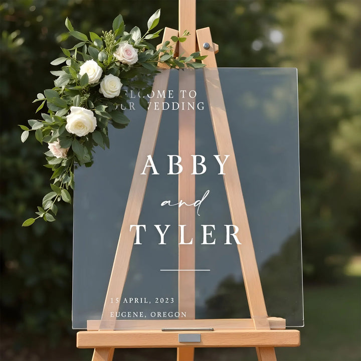 Modern minimalist wedding welcome sign on clear acrylic — personalized with names and date | iCustomLabel