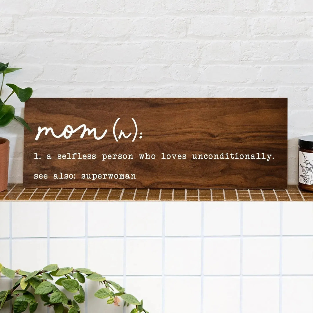 Wooden mom definition sign on shelf with plant and candle, home decor gift idea