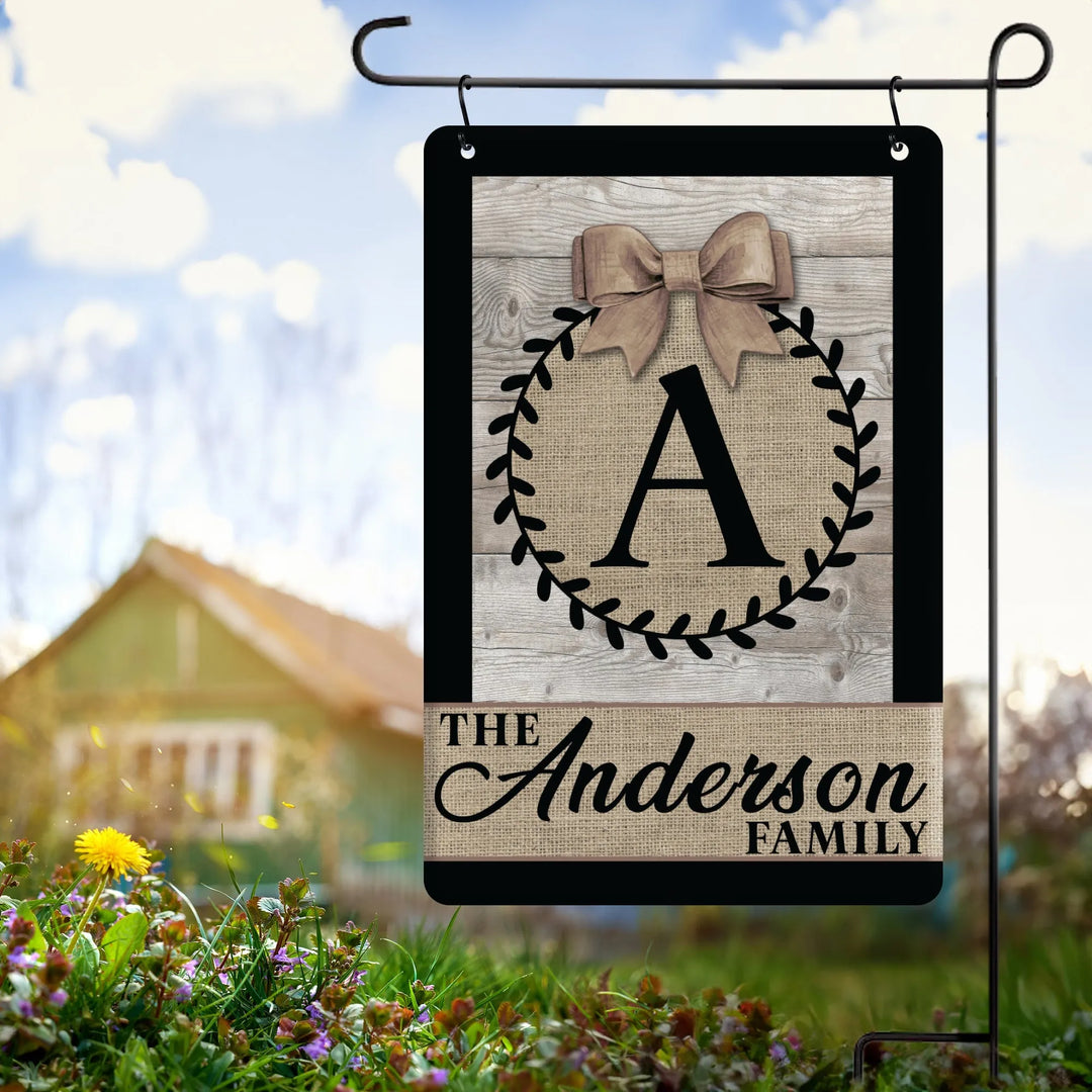 Personalized burlap garden flag with monogram A and Anderson family name on metal stand