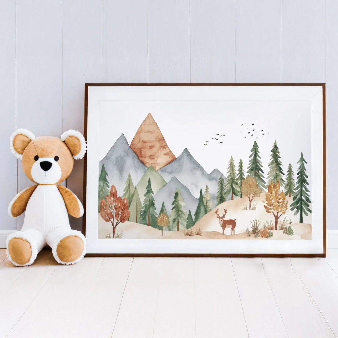 Watercolor nursery wall art featuring mountains, pine trees, and a deer, with soft earthy tones
