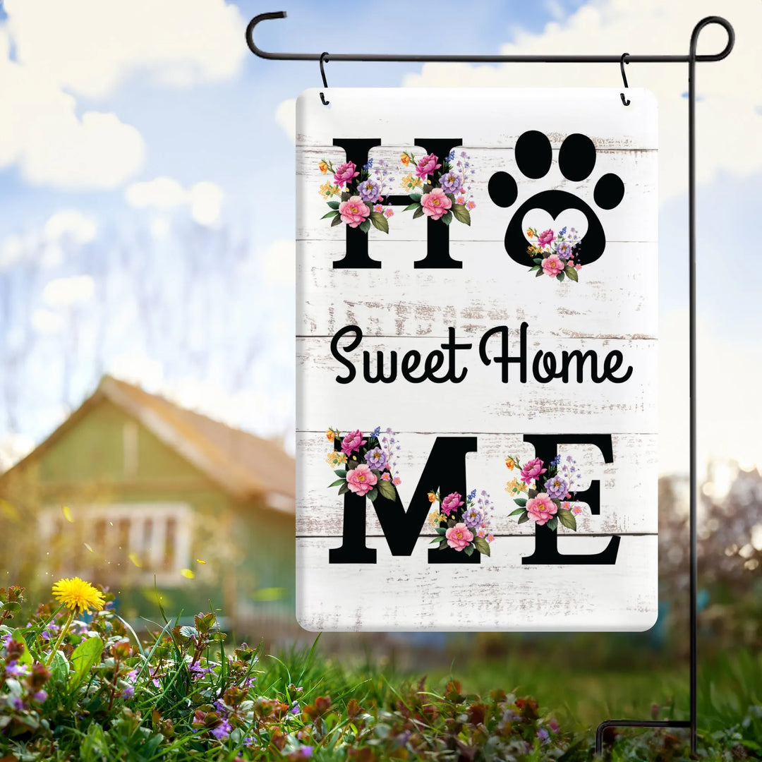 White metal garden flag with floral decorated text 'Home Sweet Home' and a paw print design