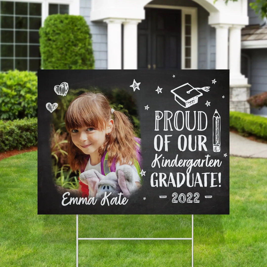 Kindergarten graduation yard sign with photo of girl Emma Kate, blackboard style text and drawings, 2022