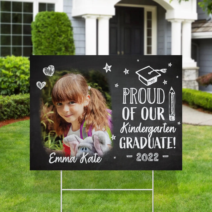 Kindergarten graduation yard sign with photo of girl Emma Kate, blackboard style text and drawings, 2022