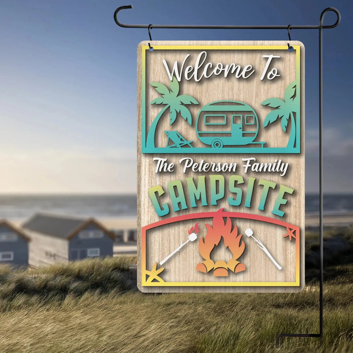 Personalized beach garden flag with camper, palm trees, campfire, and marshmallows at campsite