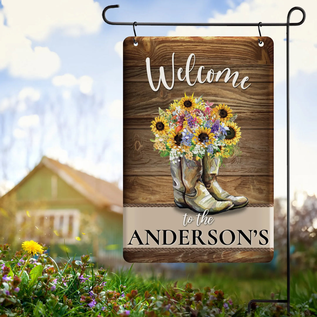 Rustic garden flag with welcome message, cowboy boots filled with sunflowers and wildflowers