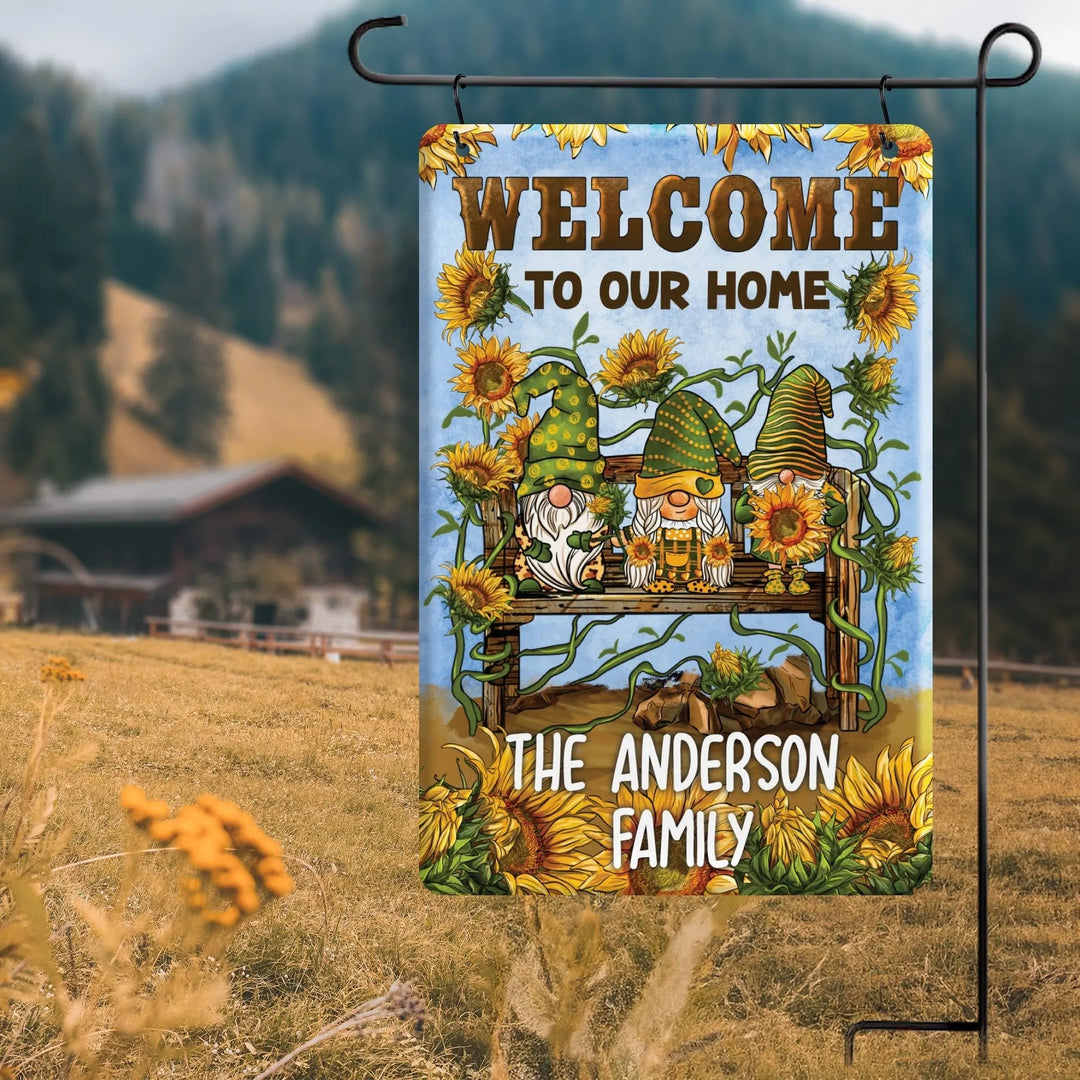 Personalized garden flag with sunflowers, three gnomes on a bench, and welcome message