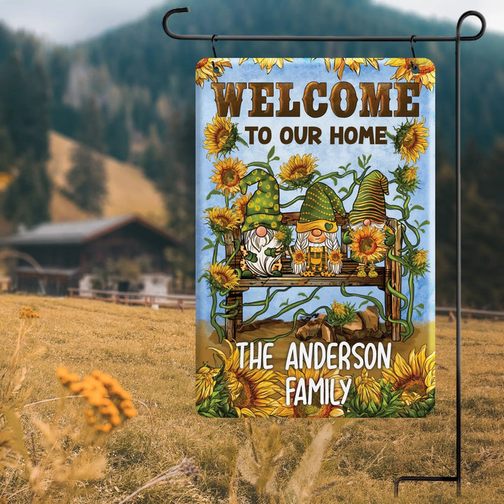 Personalized garden flag with sunflowers, three gnomes on a bench, and welcome message