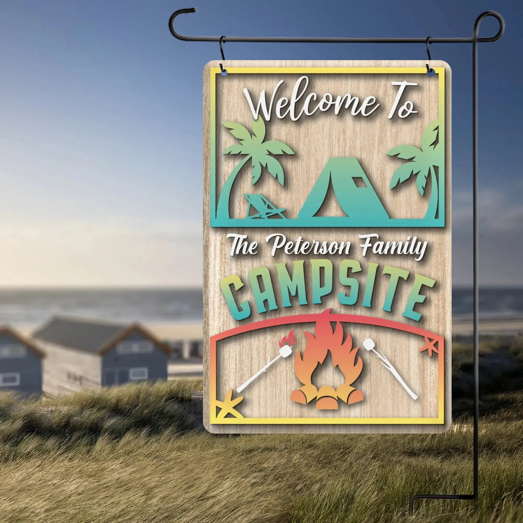 Personalized wooden garden flag with camping tent, palm trees, campfire, and text Welcome to The Peterson Family Campsite