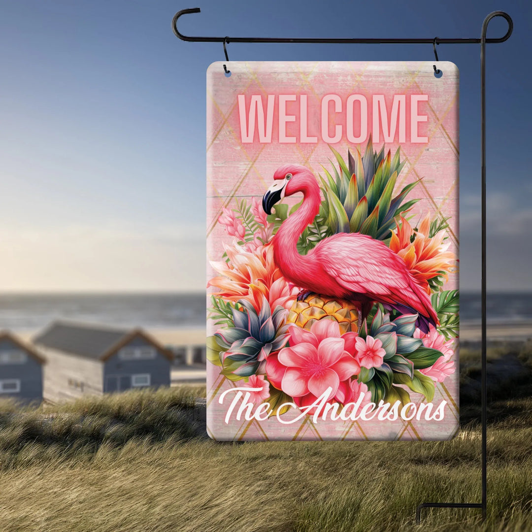 Personalized tropical garden flag with pink flamingo, flowers, pineapple, welcome sign, and The Andersons name
