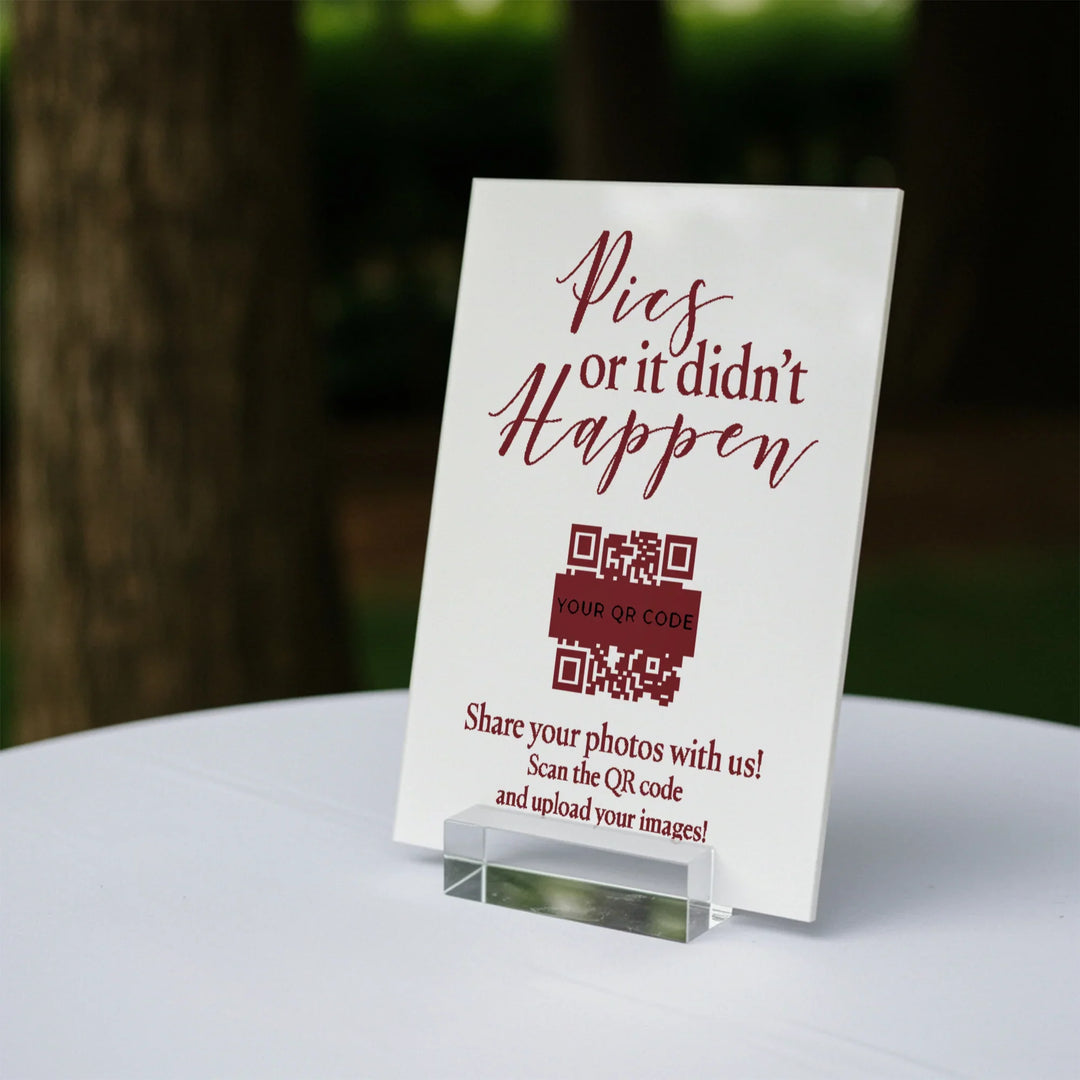 Wedding table sign with burgundy text saying Pics or it didn't happen and a QR code for photo sharing