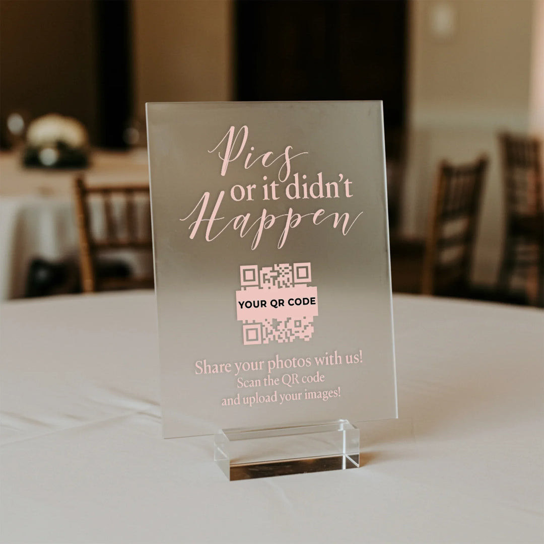 Clear acrylic wedding table sign reading 'Pics or it didn't happen' with QR code for photo sharing